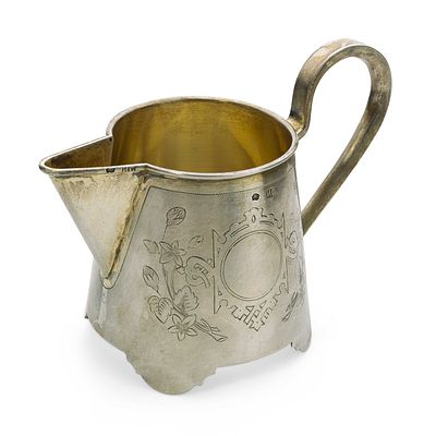 PARCEL-GILT SILVER MILK JUG ENGRAVED WITH A FLORAL MOTIF
Ivan Saltykov, 1884-1917. Hallmark: 