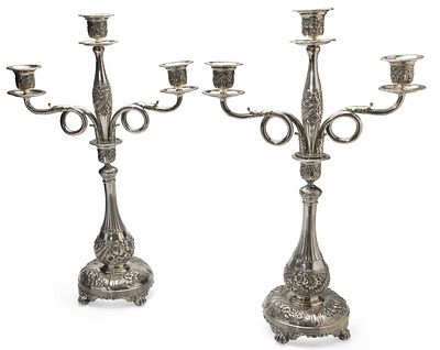 TIFFANY & CO. PAIR OF SILVER SOLDERED THREE-LIGHT CANDELABRA WITH FLOWER DECORATION. each on a 