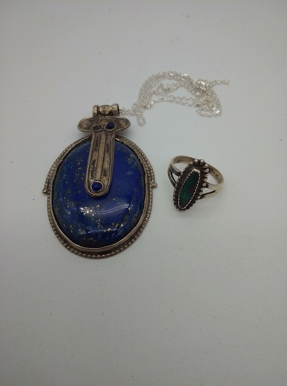 Lot 151: Lapis Lazuli Stone Pendant and Silver Navajo ring...