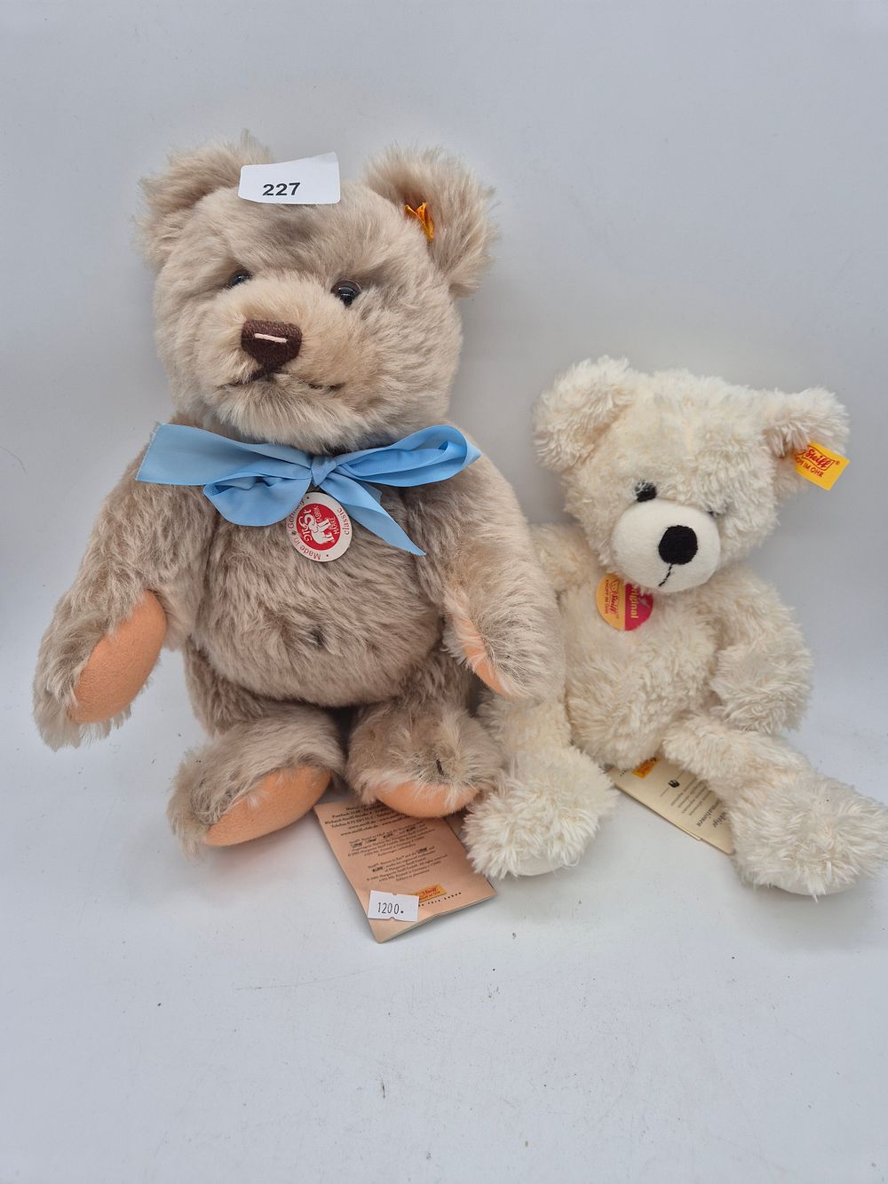 Lot 227: 2 Steiff Teddies with tags and label's one...