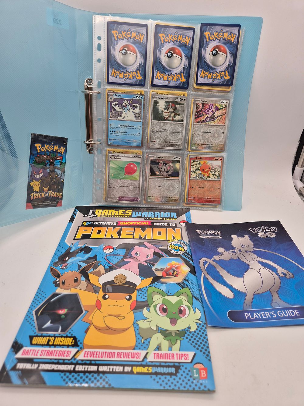 Lot 229: Pokemon cards and guide book