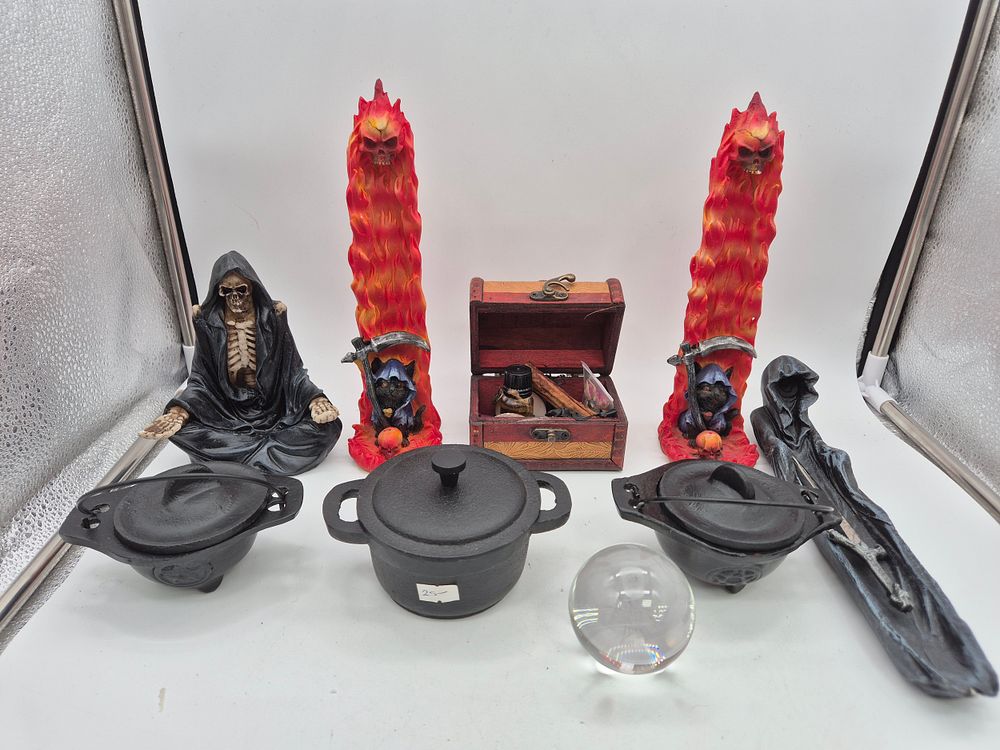 Lot 232: Gothic Cast iron cauldrons candles and crystal ball...