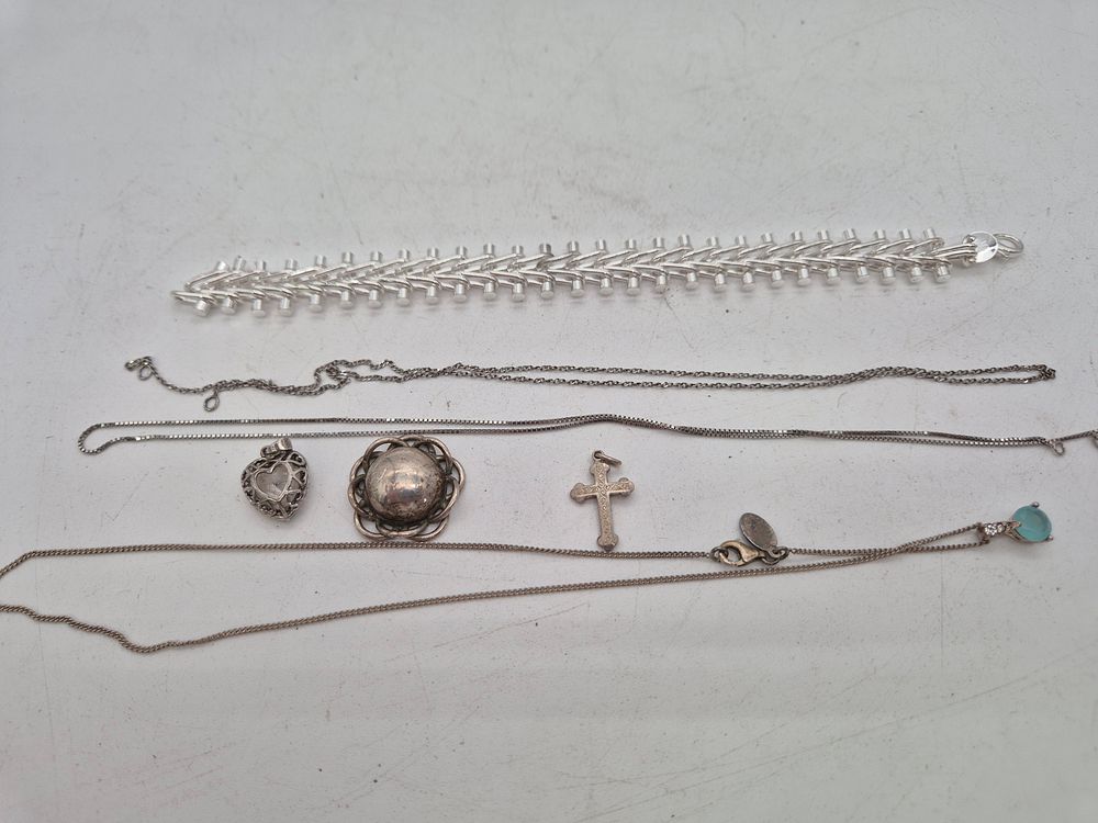 Lot 214: Bag of silver necklaces, bracelets and charms 43g