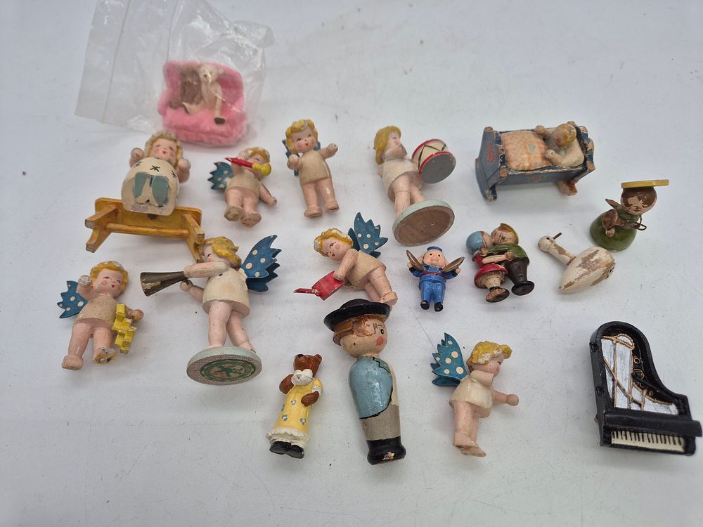 Lot 215: A collection of vintage cake decorations or dolls...