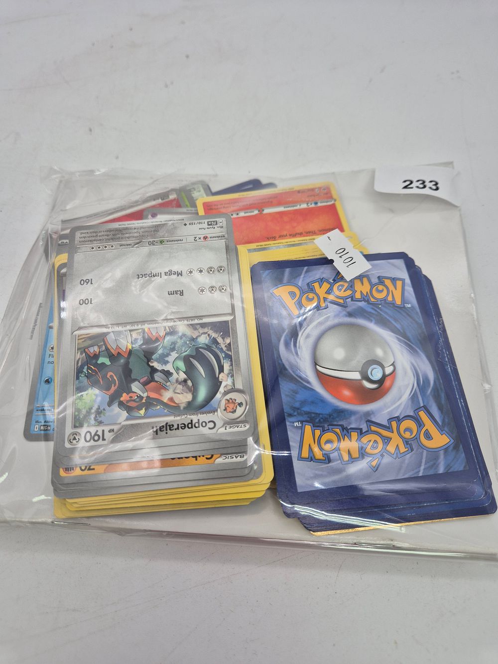 Lot 233: Pokamon cards and players guide