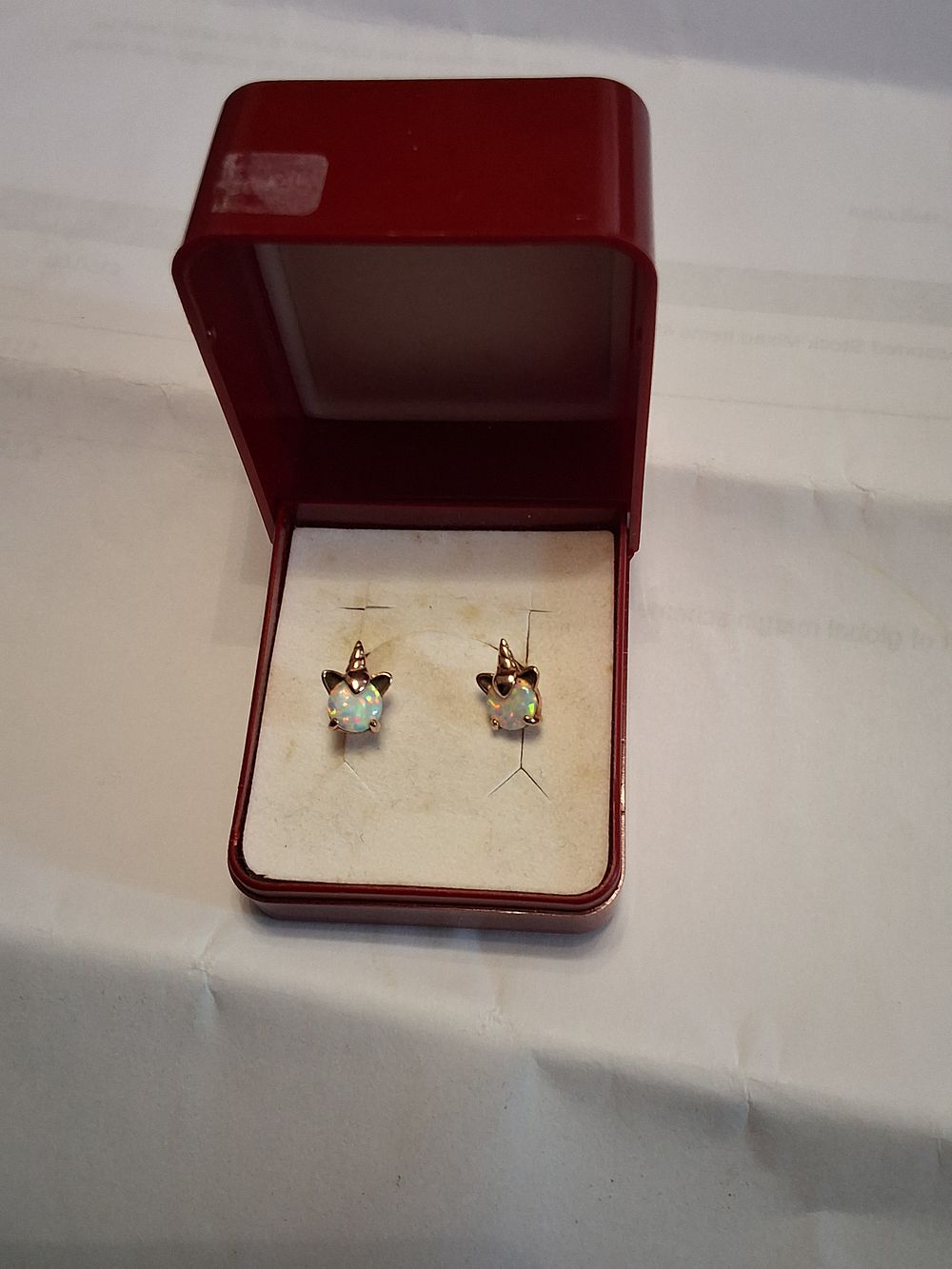 Lot 47: 9ct gold and Opal unicorn earrings.  