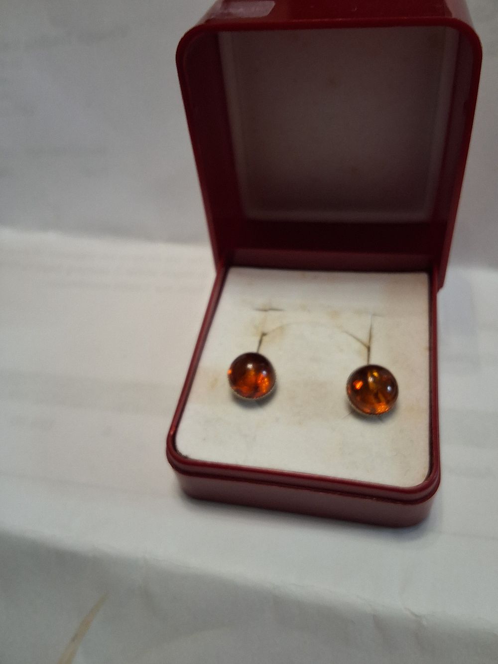 Lot 277: A pair of stearling silver and amber earings