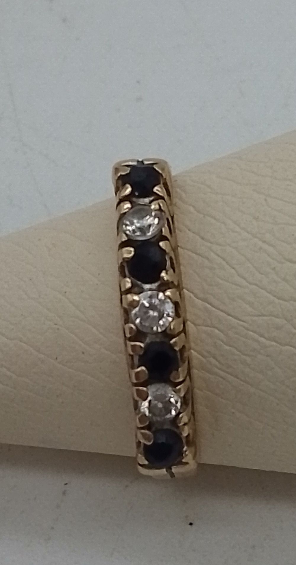 Lot 157: A 9ct Gold Sapphire and Diamond Half-Hoop Eternity...
