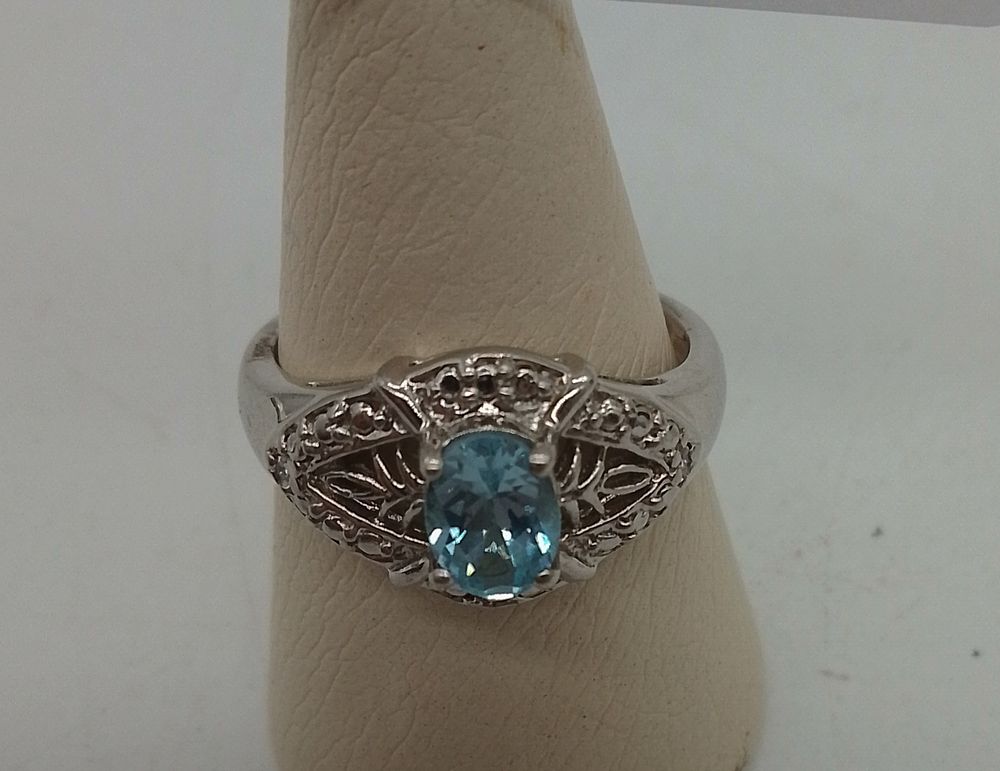 Lot 162: A 925 silver and light blue gemstone cocktail...