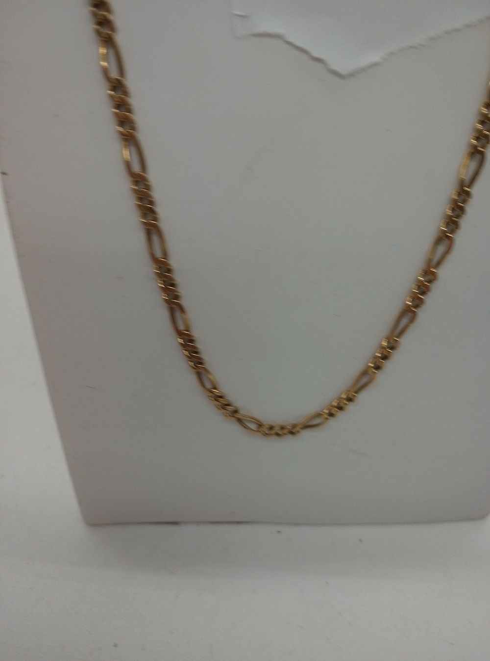 Lot 171: Possibly an 8 Carat Gold Figaro Link Chain...