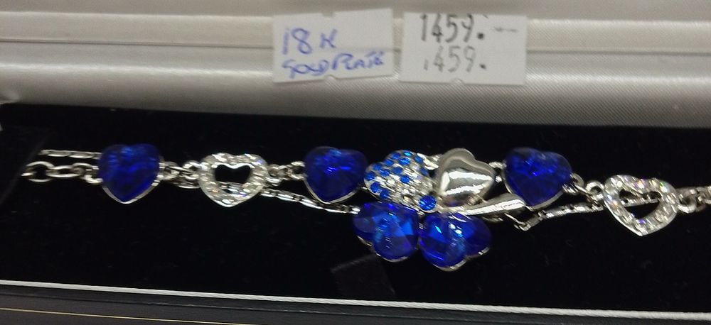 Lot 178: A Gold Plated and Blue Stone Heart Motif...
