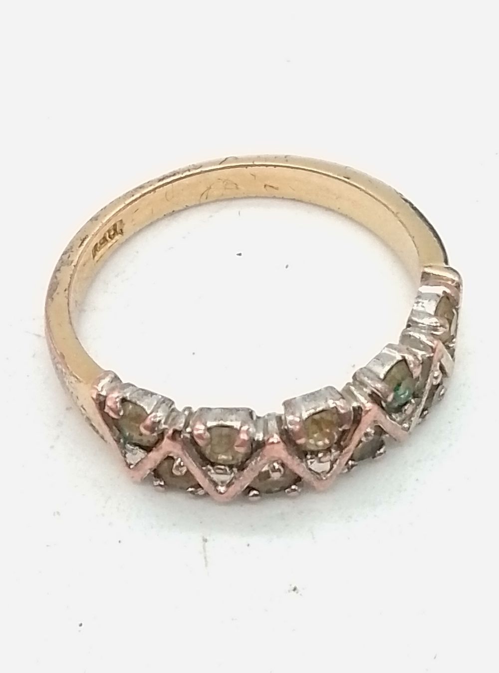 Lot 186: A Gold Plated Multi-Stone Zig-Zag Band Ring in...