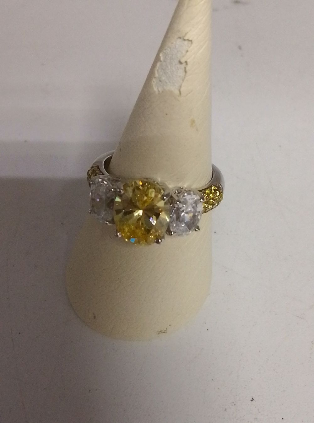 Lot 229: A Silver Trilogy Style Ring with Yellow and...