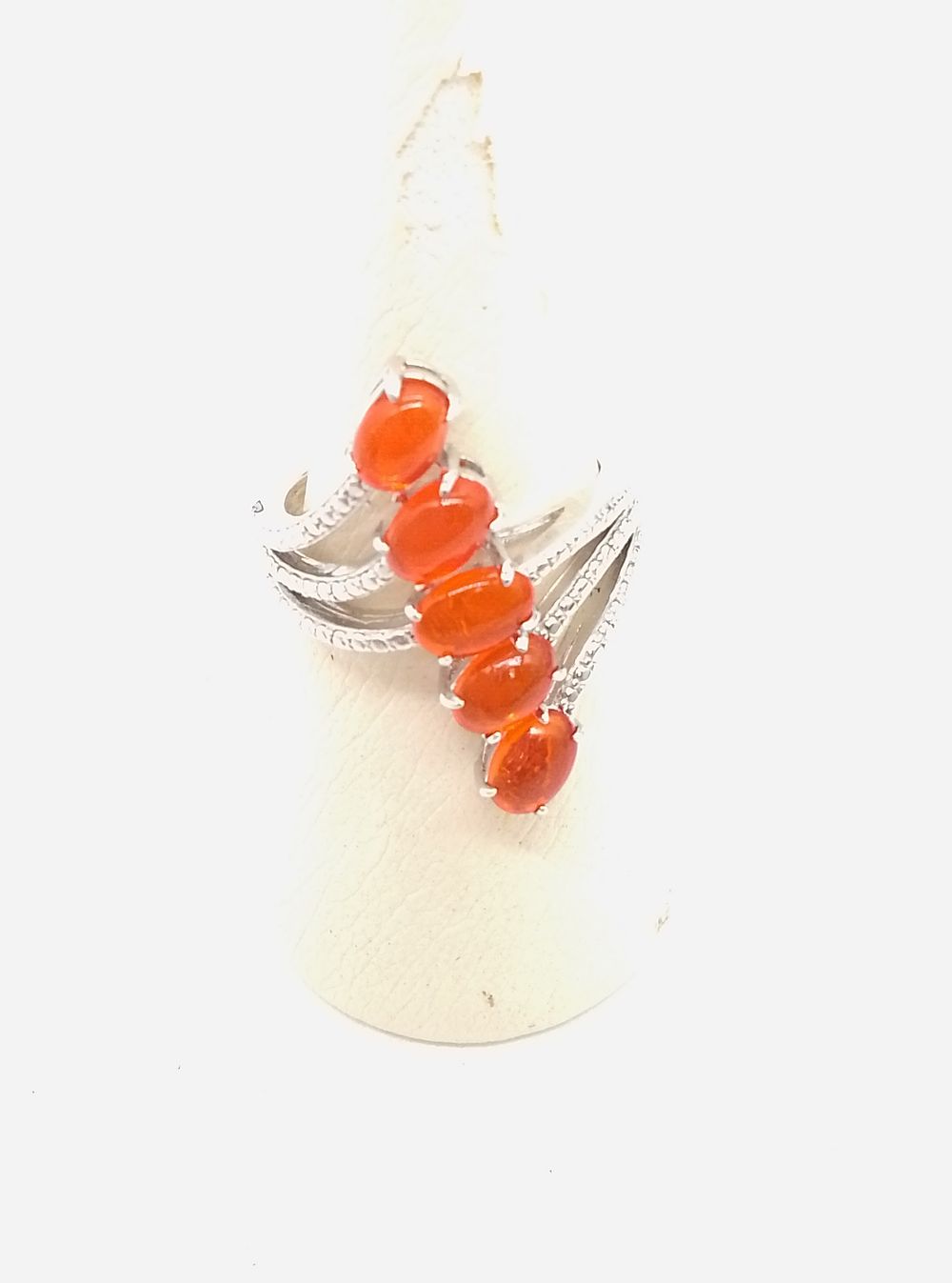 Lot 231: A Silver Five-Stone Orange Cabochon Cocktail Ring