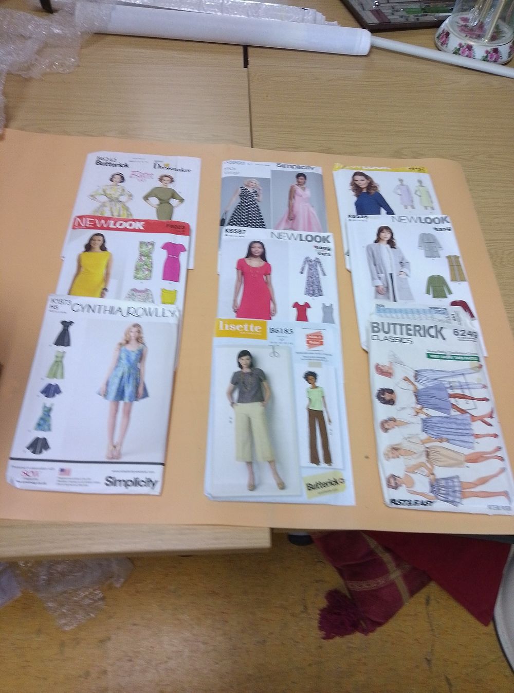 Lot 303: A Collection of Dressmaking Patterns and Craft Magazines...