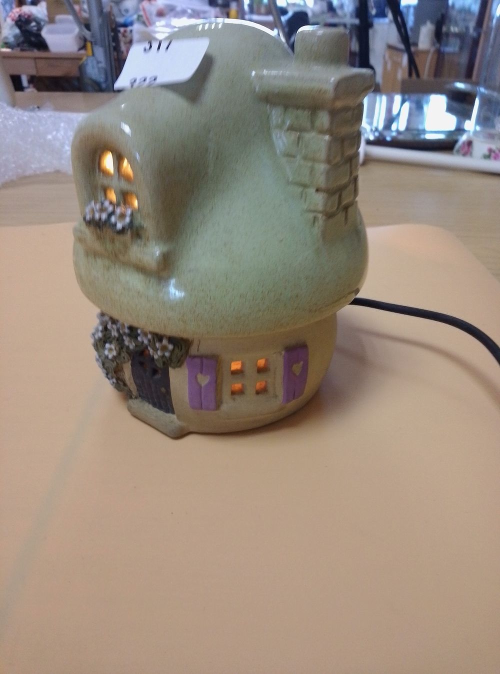 Lot 317: A ceramic whimsical fairy cottage table lamp