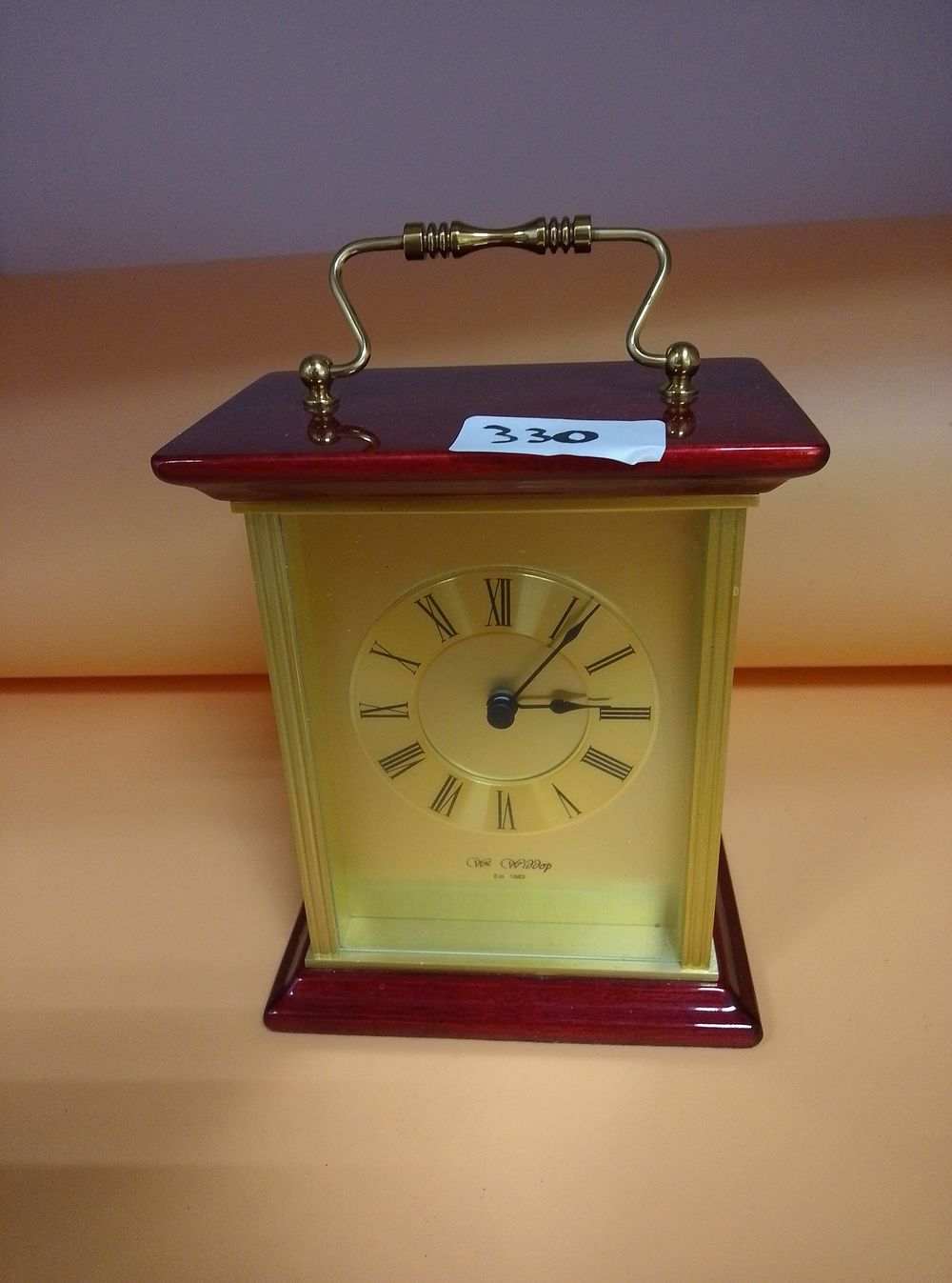 Lot 330: A Wm. Widdop Quartz Carriage-Style Mantel Clock