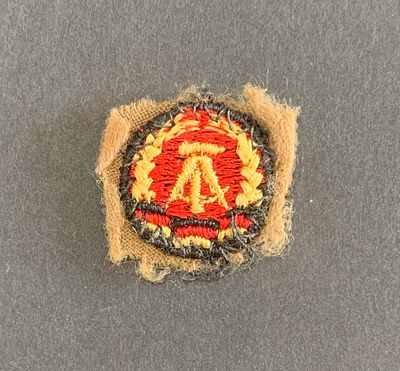 Small insignia patch of the East German Army, pre 1991; removed from uniform