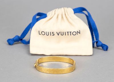 Louis Vuitton, narrow hinged bangle, gold-colored metal with surrounding logo decoration, incl. 
