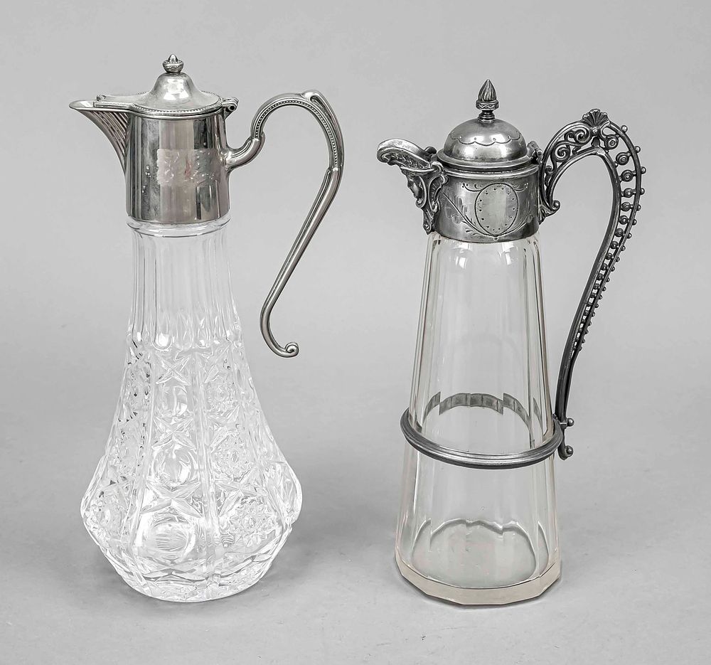 Two gift jugs, 20th century, each with metal mounting with hinged lids, 1x clear glass 