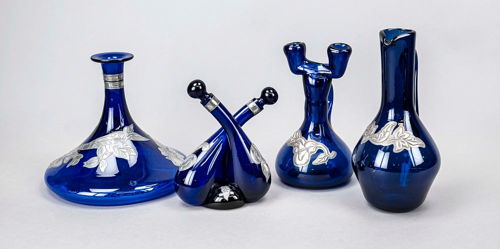 Four carafes, 20th century, various shapes and sizes, cobalt blue glass with applied floral 