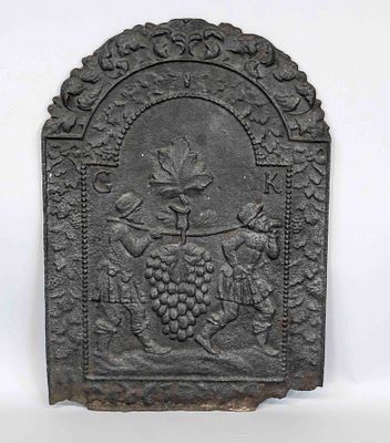 Fireplace plate, probably 18th century, iron. Rounded shape at the top, relief decoration with 