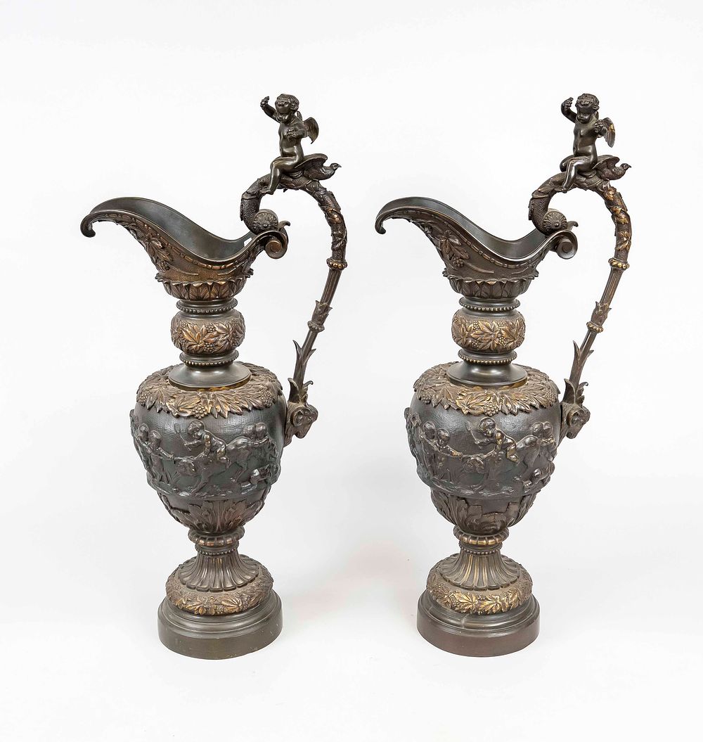 Pair of large historicist ceremonial jugs, late 19th century, bronze. Balustrade body with 