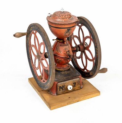 Large coffee grinder, USA late 19th century, cast iron with polychrome decoration. Central 
