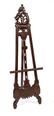 Easel, mahogany, openwork and ornamentally carved, height-adjustable picture rest, rubbed and 