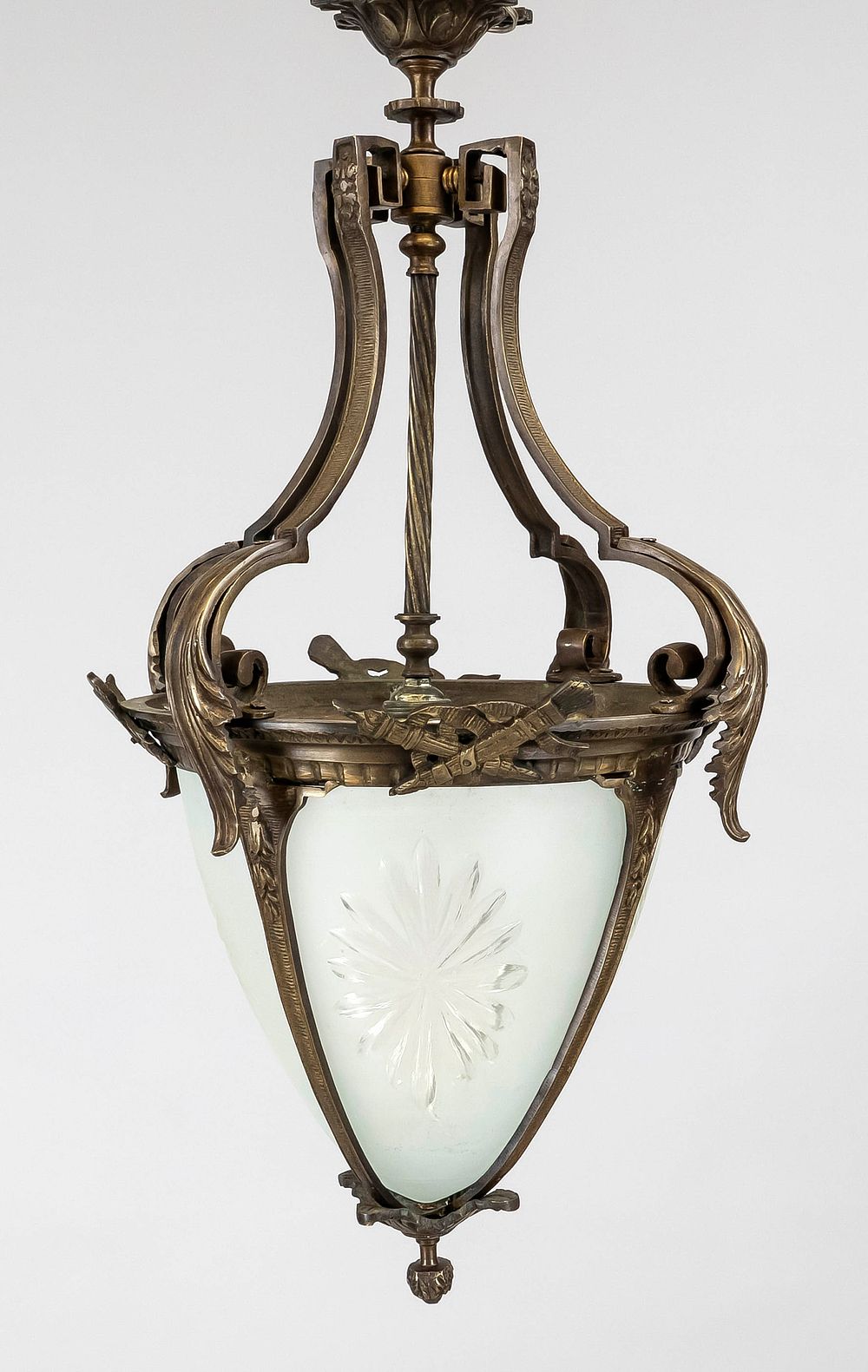 Ceiling lamp, 20th century, bronze. Ornate wreath with decorative appliqués, partially covered 