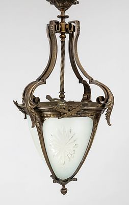 Ceiling lamp, 20th century, bronze. Ornate wreath with decorative appliqués, partially covered 