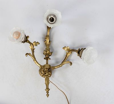 Wall lamp, 20th century, brass. 3-light, with rocaille, glass shades (1 x chipped). H. 50 cm