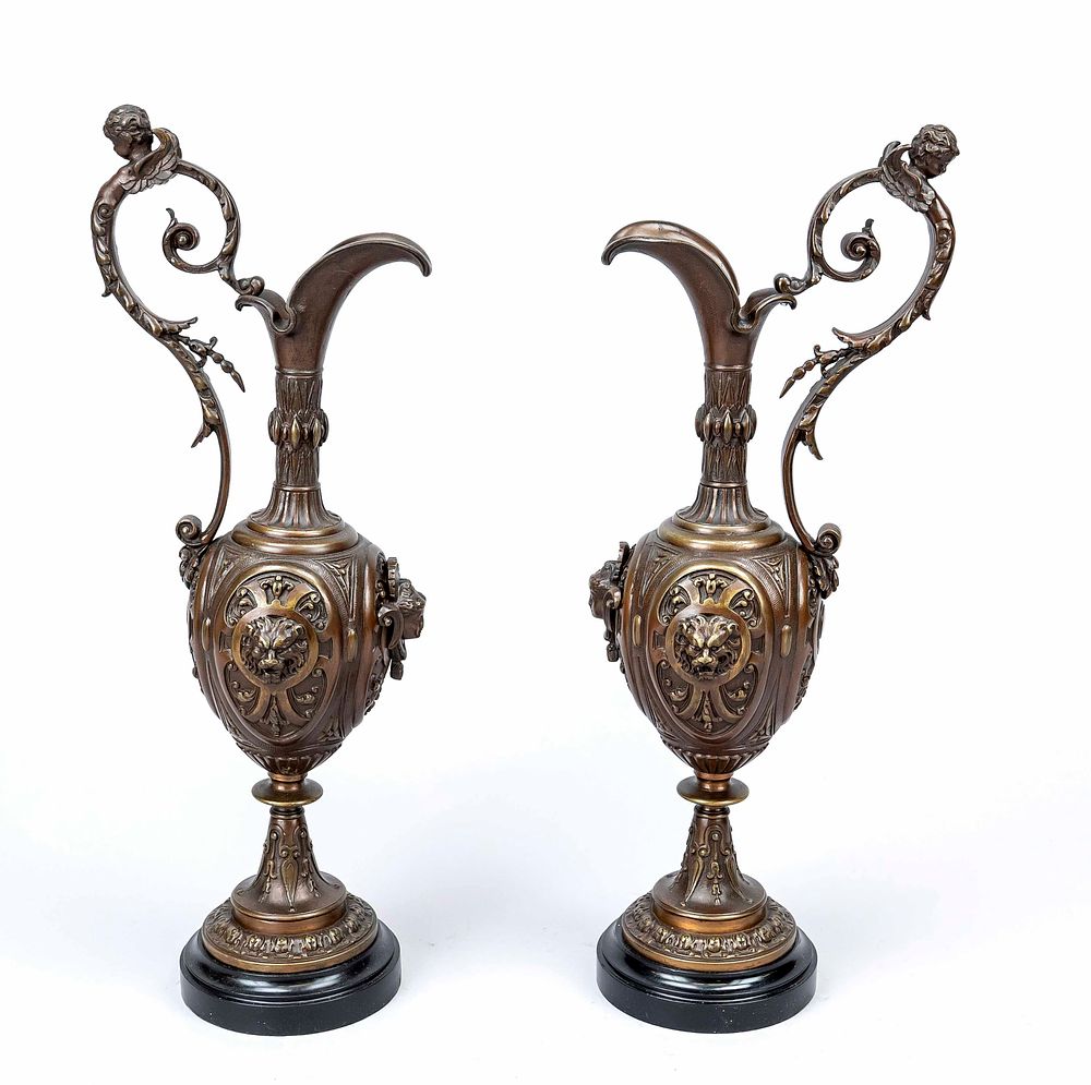 Pair of ornate side tables in the form of jugs, 19th century, bronze with dark patina. Putti on 