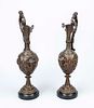 Pair of ornate side tables in the form of jugs, 19th century, bronze with dark patina. Putti on Image - 1