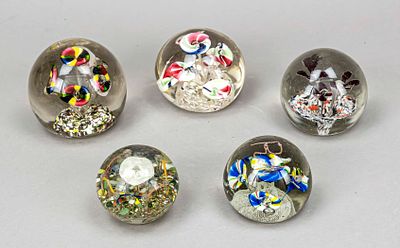 Five paperweights, 20th century, each spherical in shape, with enclosed glass flowers and air 