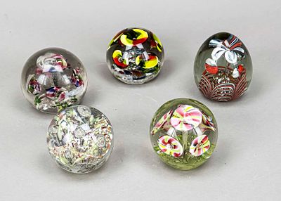 Five paperweights, 20th century, 4 spherical, 1 ovoid, each with enclosed glass bubbles and air 