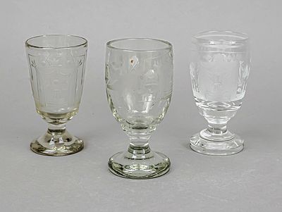 Three lodge glasses, circa 1900, each goblet-shaped, clear glass with different cut decorations 