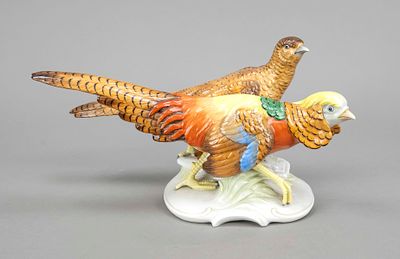 Pair of pheasants, A.W.Fr. Kister, Scheibe-Alsbach, marked 1905-72, on curved grass base 