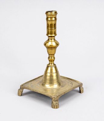 Baroque bronze candlestick, 18th century, square base with fluted decoration, on abstract lion 