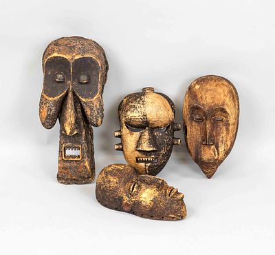 4 masks, Africa, exact age unknown, wood. Partially weathered, rubbed and scuffed, up to 54 cm high