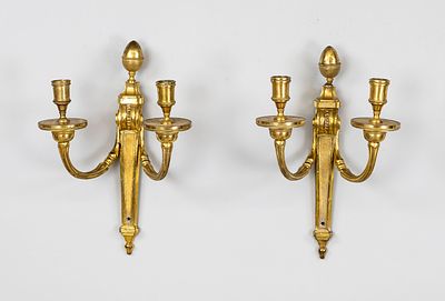 Pair of wall sconces, 19th century, gilded bronze. Each with two flames and curved arms (1x 