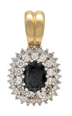 Sapphire brilliant clip pendant GG/WG 585/000 with an oval faceted sapphire 8.9 x 7.0 mm dark 