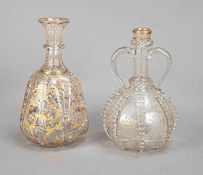 Two carafes, 1st half of the 20th century, different shapes, each clear glass with gold 