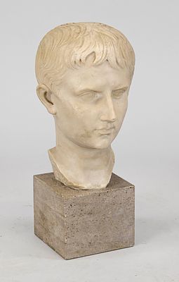 Bust of Augustus, heavy stone cast from the 20th century, on cream-colored marble pedestal 