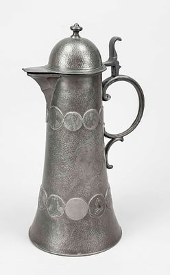 Large jug with coin decoration, late 19th century, pewter. Conical shape, handle and hinged 