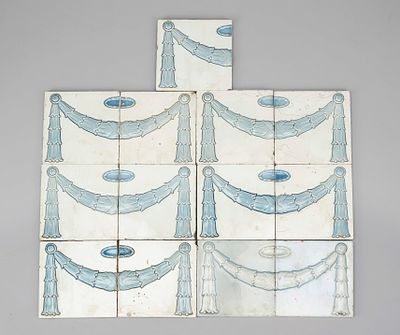 13 Art Nouveau tiles, circa 1910, relief decoration painted light blue and glazed, always two 