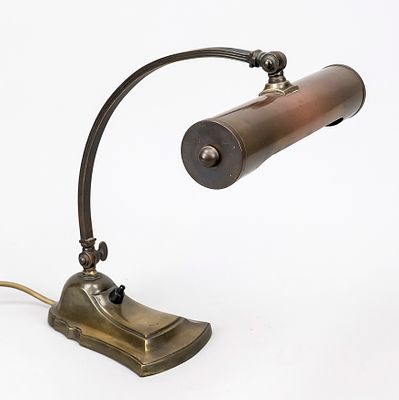 Art Deco table lamp, early 20th century, brass. Stepped base, curved shaft, shade in the style 