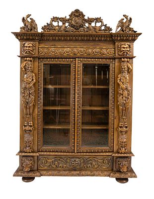Display cabinet, circa 1900, solid oak, carved beam figures, mascaron, dragons, and griffins 