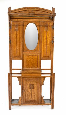 Art Nouveau coat rack, circa 1910, oak, oval faceted mirror, glove compartment in the center 