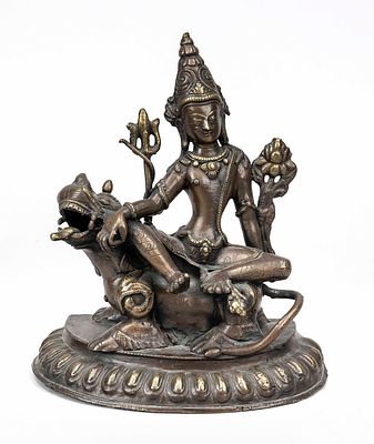 Manjushri on lion, probably Tibet, 19th century, bronze. On a lotus base without base plate, H. 